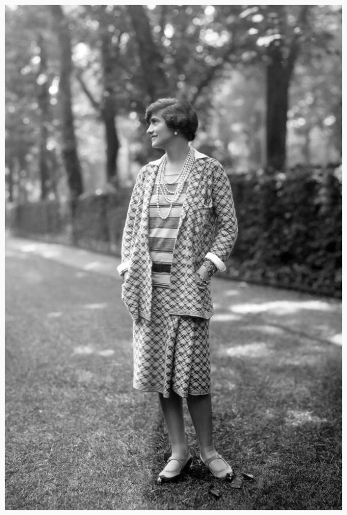 coco chanel designs: Gabrielle “Coco” Chanel wearing one of her suits in Paris, France. Elle.
