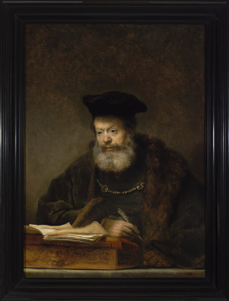 Rembrandt Girl in a Picture Frame: Rembrandt, Scholar at His Writing Table, 1641, Royal Castle in Warsaw, Warsaw, Poland.
