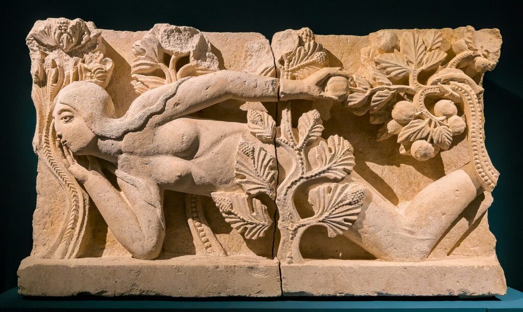 pilgrimage churches: Temptation of Eve, lintel from the Cathedral of Saint Lazarus of Autun, Musée Rolin, Autun, France. Photograph by Benjamin Smith via Wikimedia Commons (CC BY-SA 4.0).
