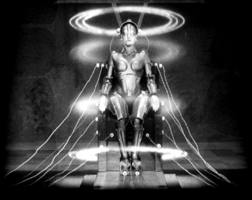 Ralph McQuarrie: Movie still with the robot from Metropolis directed by Fritz Lang, 1927. Wikimedia Commons (public domain).
