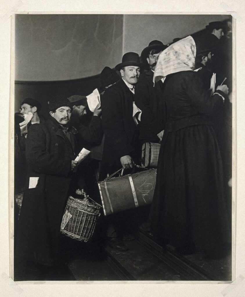 migrant photographs: Lewis Hine, Climbing into the Promised Land, Ellis Island, 1905, Brooklyn Museum, New York City, NY, USA.
