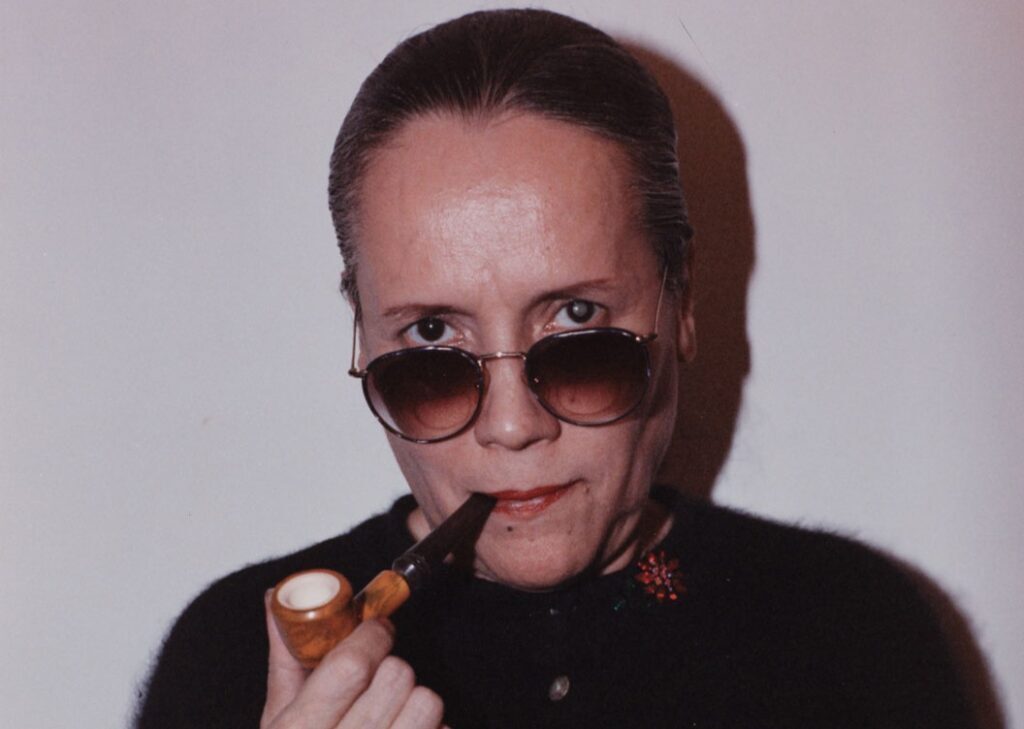 new york art week: Detail. Sophie Rivera, Untitled, c. mid-1980s. Rivera’s color self-portrait shows her with a tobacco pipe, the one a doctor blamed for the cataracts seen obscuring her eyesight. (El Museo del Barrio).
