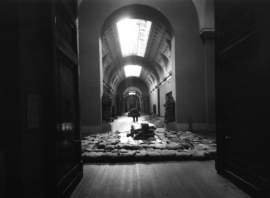 Evacuation of Prado Museum: The Central Gallery of the Prado Museum, dismantled and protected with sandbags in October 1936. Museo del Prado.

