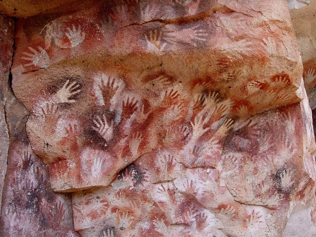 DailyArt Magazine birthday: Painting at Cueva de las Manos, 7300 BCE–700 CE, Santa Cruz, Argentina. Photograph by Mariano via Wikimedia Commons (public domain).
