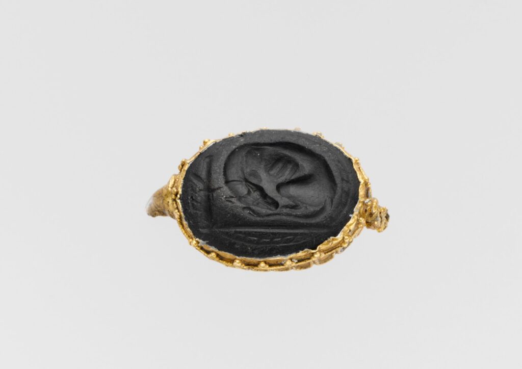Obsidian rock: Greek Obsidian seal set in a gold ring, ca. 450–400 BCE, Metropolitan Museum of Art, New York, NY, USA. Museum’s website.

