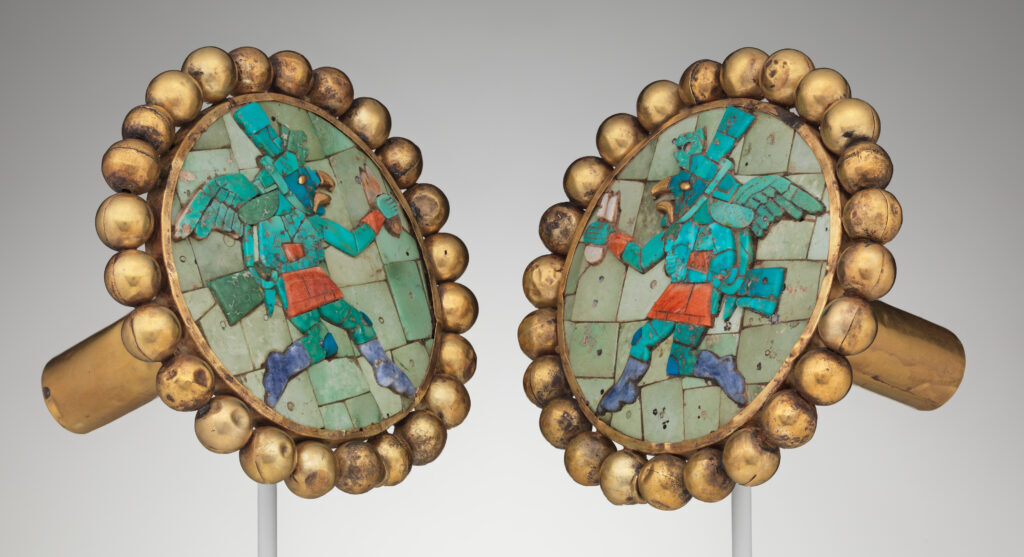 Anthropeum: Pair of ear ornaments with winged runners, Peru, 400–700 CE, Metropolitan Museum of Art, New York City, NY, USA.
