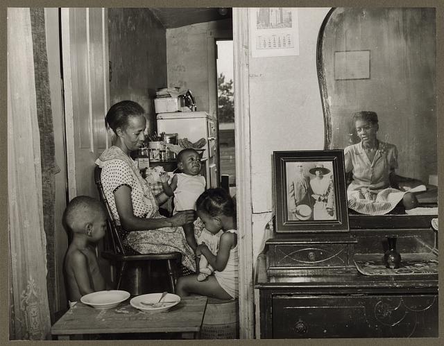 mirrors in art: Mirrors in art: Gordon Parks, Mrs. Ella Watson, a government charwoman, with three grandchildren and her adopted daughter, 1942, Library of Congress, Washington, DC, USA.
